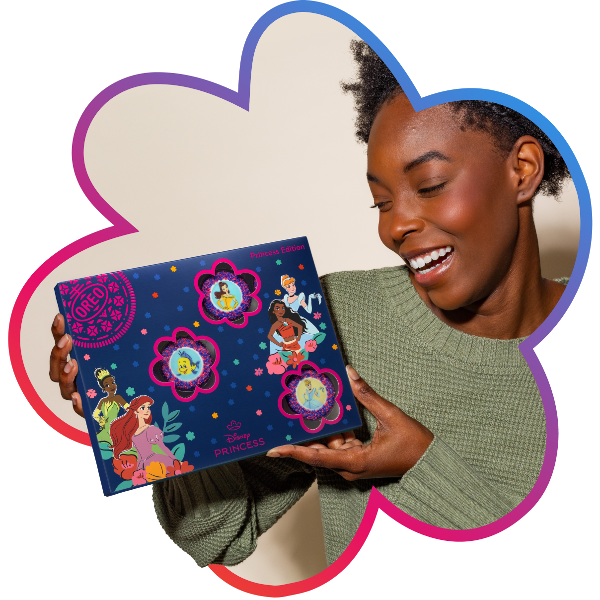 Smiling person holding limited edition OREO Disney Princess 12 Pack.